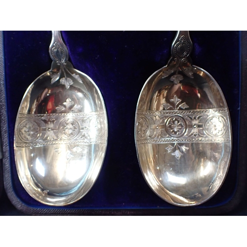 292 - A CASED PAIR OF ATKIN BROS SERVING SPOONS silver-plated, with figural terminals depicting kings (one... 