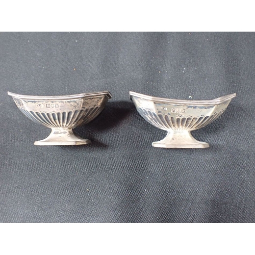 307 - A PAIR OF SILVER SALTS with a silver basket and two small pierced trays