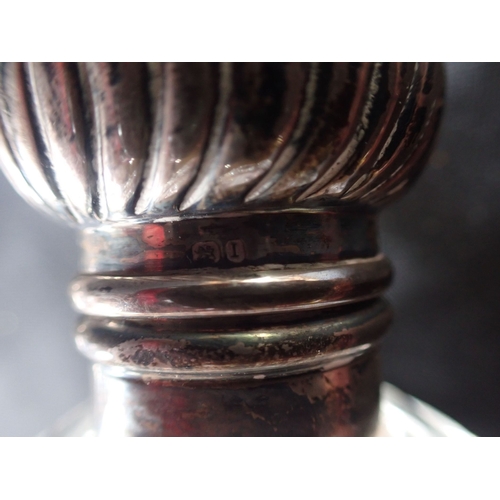 309 - TWO SILVER TOPPED SCENT BOTTLES with a silver rimmed and lidded pot