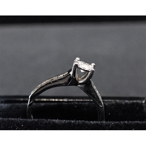 321 - 9ct WHITE GOLD AND DIAMOND RING Diamond carat weight is 1/4ct.