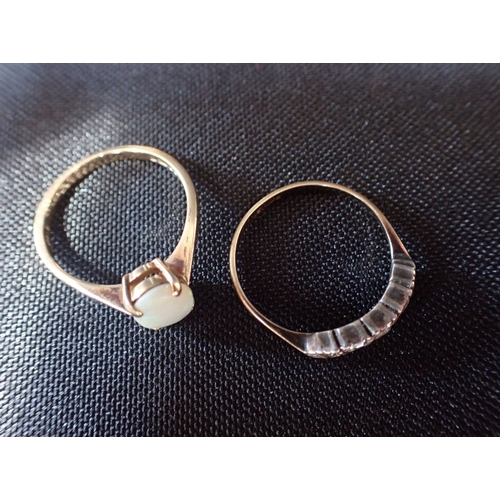 322 - TWO 9CT GOLD RINGS and an unmarked yellow metal locket