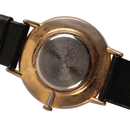 337 - GUCCI: A LADIES' GOLD-PLATED WRISTWATCH with a quartz movement, the silver dial with gold hands, no.... 
