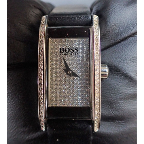 340 - HUGO BOSS: A LADIES' STAINLESS STEEL WRISTWATCH with quartz movement, on a black leather strap, in t... 