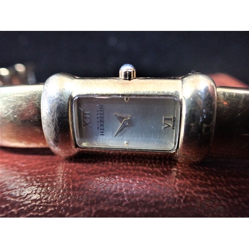 340 - HUGO BOSS: A LADIES' STAINLESS STEEL WRISTWATCH with quartz movement, on a black leather strap, in t... 