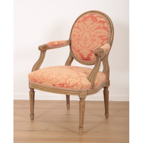 101 - A PAIR OF LOUIS XVI STYLE GREY PAINTED FAUTEUILS with floral damask covers, on fluted and tapered le... 