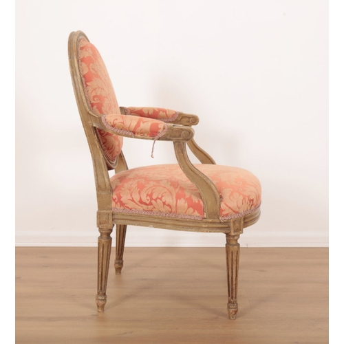 101 - A PAIR OF LOUIS XVI STYLE GREY PAINTED FAUTEUILS with floral damask covers, on fluted and tapered le... 