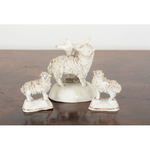 102 - TWO PAIRS OF STAFFORDSHIRE PEN HOLDERS modelled as sheep, each 8.5cm high x 6.5cm high, plus a singl... 