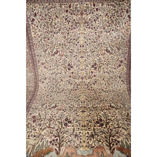 106 - A PERSIAN SILK 'TREE OF LIFE' CARPET the pale ivory ground with a central tree surrounded by stylise... 