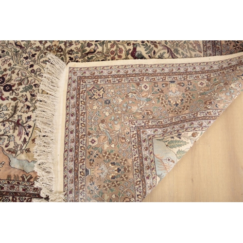 106 - A PERSIAN SILK 'TREE OF LIFE' CARPET the pale ivory ground with a central tree surrounded by stylise... 