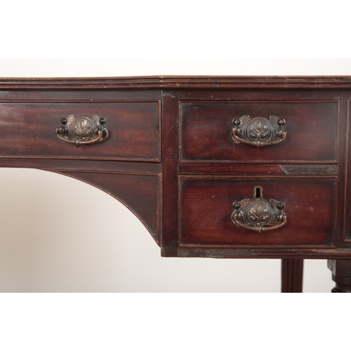 11 - A REGENCY STYLE MAHOGANY DRESSING TABLE the inverted breakfront top over an arrangement of five shor... 