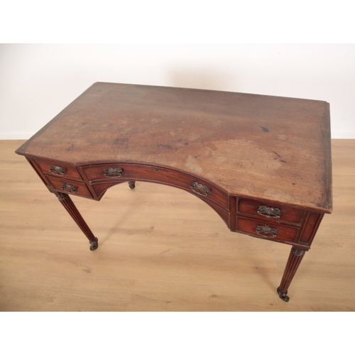 11 - A REGENCY STYLE MAHOGANY DRESSING TABLE the inverted breakfront top over an arrangement of five shor... 