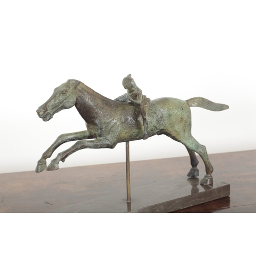 116 - AFTER THE ANTIQUE, A BRONZE FIGURE OF THE JOCKEY OF ARTEMISION raised on a marble plinth base, 35cm ... 