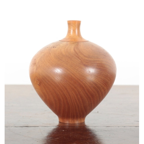 13 - A TURNED WOOD VASE with tapered neck and rotund body, numbered 83 to the base, 17cm high