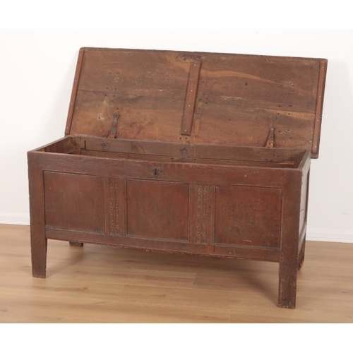 14 - AN OAK COFFER late 17th/early 18th century, the hinged lid opening to a vacant interior, the panelle... 