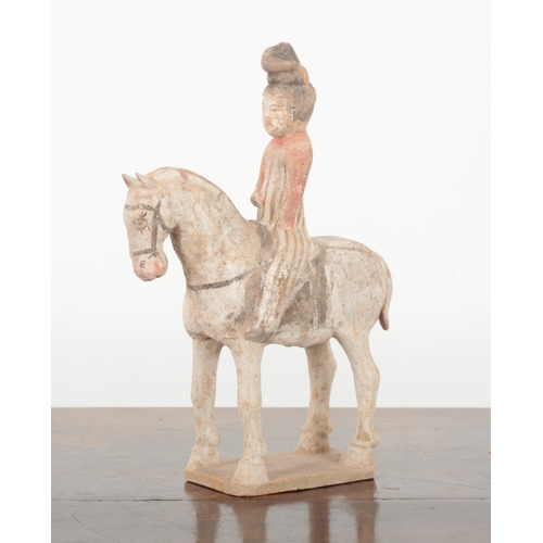 18 - A CHINESE PAINTED POTTERY HORSE AND RIDER of Tang style, 35cm high