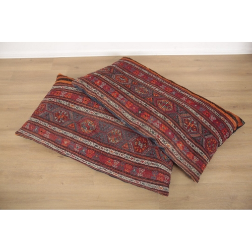 19 - A PAIR OF KILIM FLOOR CUSHIONS covered with striped and geometric designs, 126cm x 65cm, together wi... 