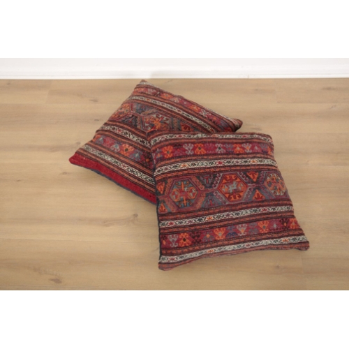 19 - A PAIR OF KILIM FLOOR CUSHIONS covered with striped and geometric designs, 126cm x 65cm, together wi... 