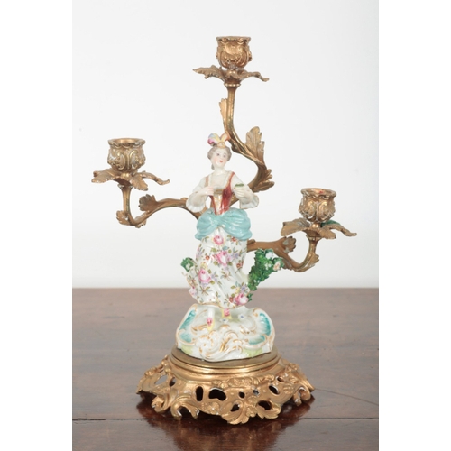 21 - A PAIR OF 19TH CENTURY FRENCH ORMOLU THREE BRANCH CANDELABRA the porcelain figures probably by Samso... 