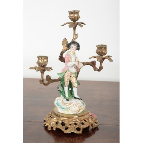 21 - A PAIR OF 19TH CENTURY FRENCH ORMOLU THREE BRANCH CANDELABRA the porcelain figures probably by Samso... 