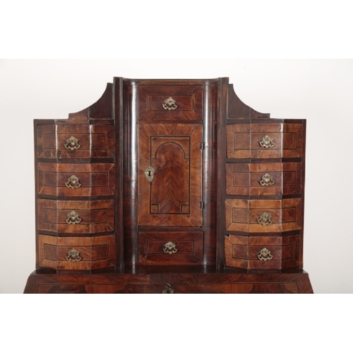 23 - A 17TH CENTURY WALNUT BUREAU CABINET ON STAND the superstructure fitted central cupboard with secret... 