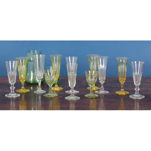 25 - AN ASSOCIATED GROUP OF CUT AND COLOURED GLASSES including a jug, 22cm high, two green glasses 11cm h... 
