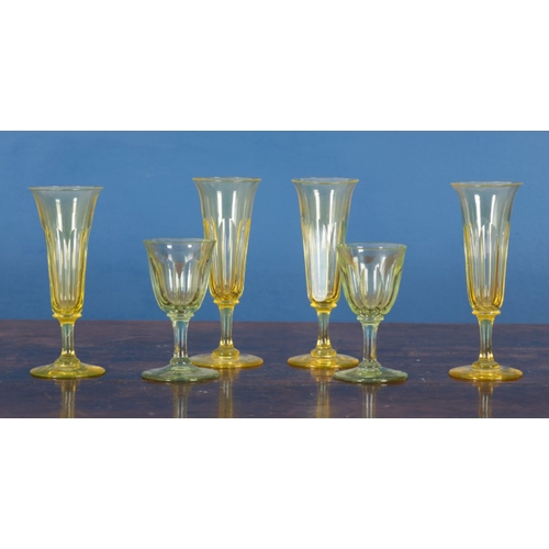 25 - AN ASSOCIATED GROUP OF CUT AND COLOURED GLASSES including a jug, 22cm high, two green glasses 11cm h... 