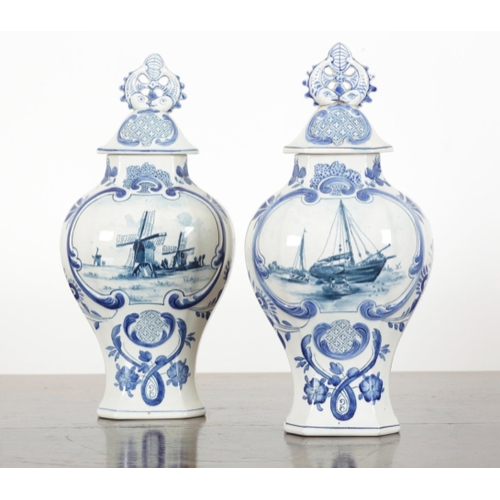 33 - A PAIR OF DUTCH DELFT VASES 20th century, both marked and impressed to the bases, decorated with cen... 