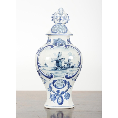 33 - A PAIR OF DUTCH DELFT VASES 20th century, both marked and impressed to the bases, decorated with cen... 