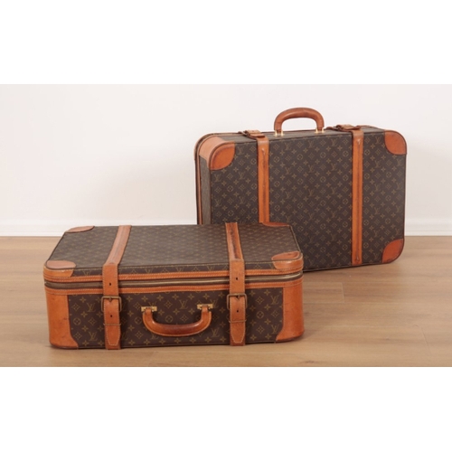 36 - A PAIR OF LOUIS VUITTON MONOGRAM SUITCASES 1970s/80s, both cases with leather straps and leather bou... 