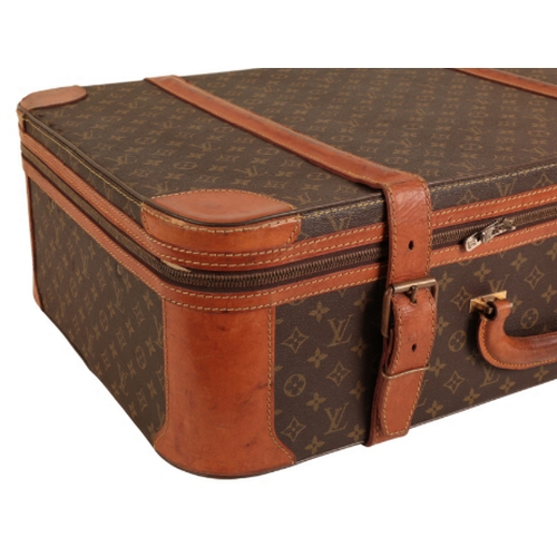 36 - A PAIR OF LOUIS VUITTON MONOGRAM SUITCASES 1970s/80s, both cases with leather straps and leather bou... 
