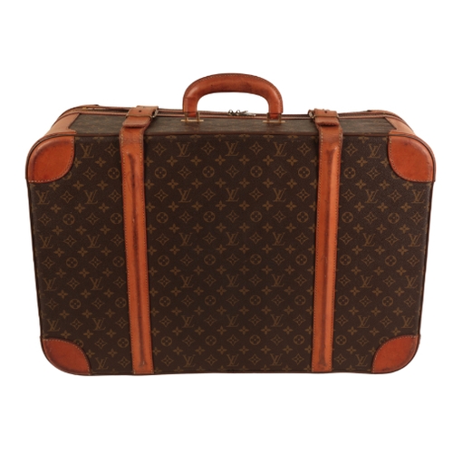 36 - A PAIR OF LOUIS VUITTON MONOGRAM SUITCASES 1970s/80s, both cases with leather straps and leather bou... 