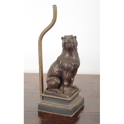 38 - A PAIR OF PATINATED METAL TABLE LAMP BASES 20th century, each figured as seated hounds, on moulded p... 