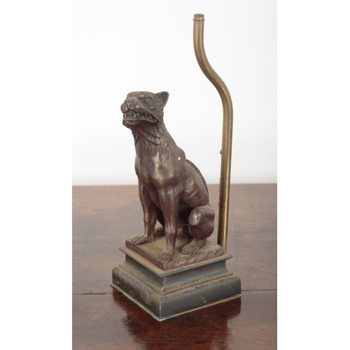 38 - A PAIR OF PATINATED METAL TABLE LAMP BASES 20th century, each figured as seated hounds, on moulded p... 