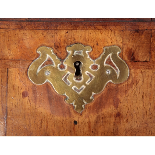 389 - AN EARLY GEORGE III FIGURED WALNUT BUREAU the crossbanded slope enclosing fitted interior, two short... 