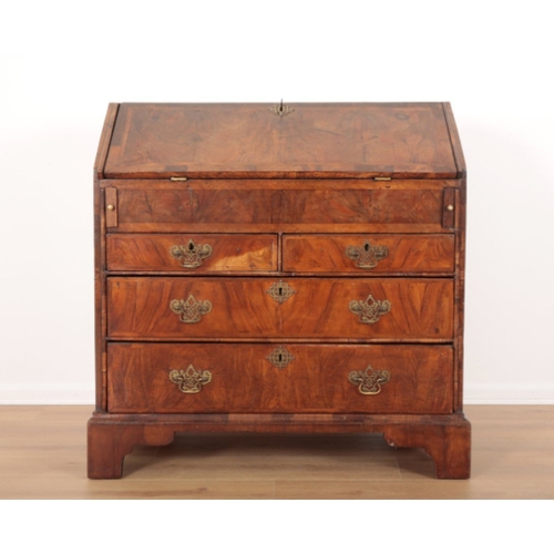 39 - A GEORGE I WALNUT BUREAU the fall front opening to an inset red baize writing surface and an interio... 