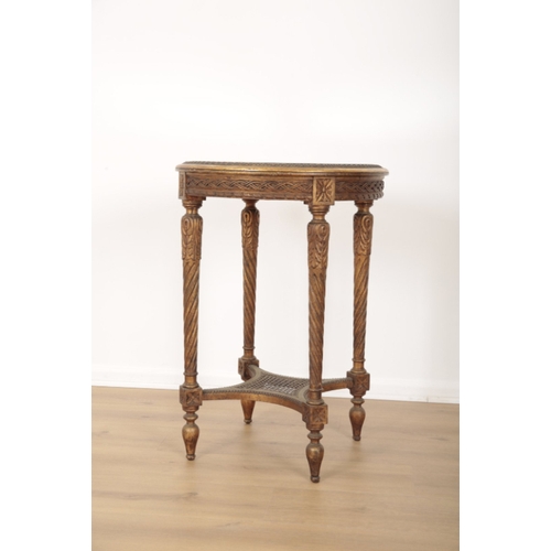 394 - A CARVED AND GILTWOOD OCCASIONAL TABLE the circular top with mirror glazed surface, on four turned l... 