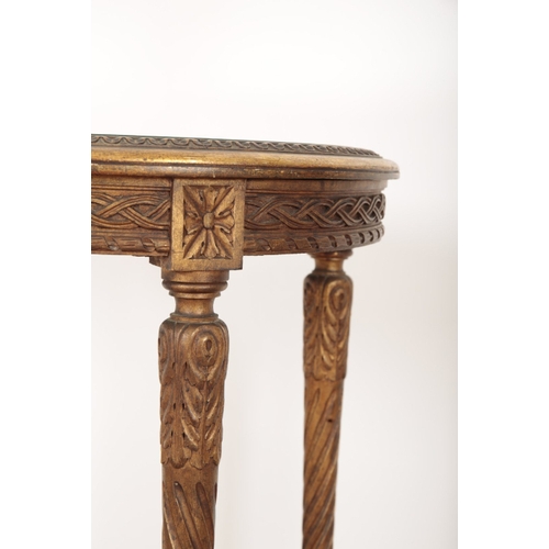 394 - A CARVED AND GILTWOOD OCCASIONAL TABLE the circular top with mirror glazed surface, on four turned l... 