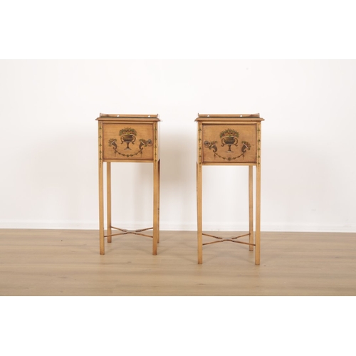 407 - A PAIR OF PAINTED SATINWOOD BEDSIDES with three-quarter galleries over single cupboard doors, decora... 