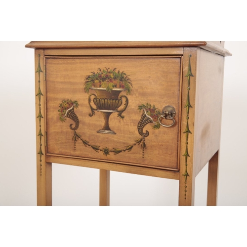 407 - A PAIR OF PAINTED SATINWOOD BEDSIDES with three-quarter galleries over single cupboard doors, decora... 