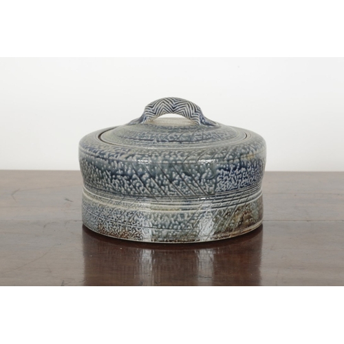 42 - *JANE HAMLYN (B. 1940): A LARGE SALT GLAZED STONEWARE LIDDED VESSEL the body of slightly waisted for... 