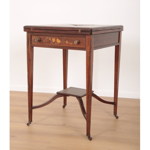 43 - AN EDWARDIAN ROSEWOOD AND MARQUETRY ENVELOPE CARD TABLE the four leaves folding outward to reveal a ... 