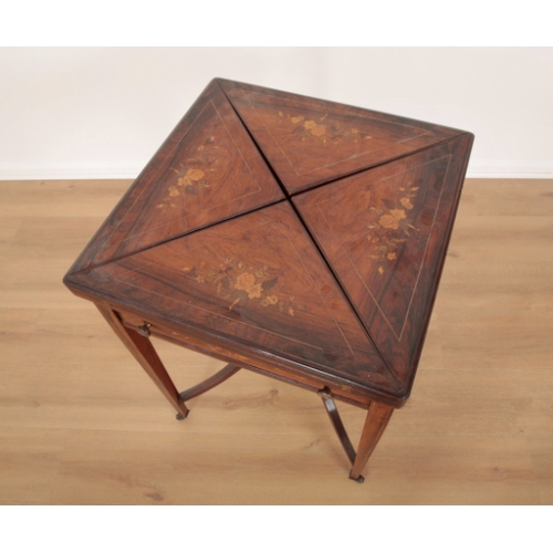 43 - AN EDWARDIAN ROSEWOOD AND MARQUETRY ENVELOPE CARD TABLE the four leaves folding outward to reveal a ... 