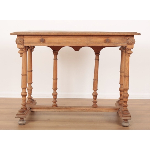47 - A VICTORIAN ELM SIDE TABLE the moulded top edge over a single drawer to one side, turned paterae aff... 