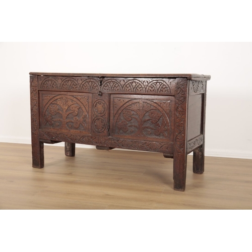 5 - A 17TH CENTURY OAK COFFER the hinged lid opening to an interior fitted with a small box to one side,... 