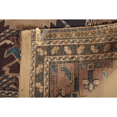 55 - A NORTH PERSIAN RUG 20th century, the dark blue ground woven with repeating geometric motifs, 175cm ... 