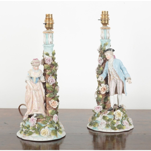 59 - A PAIR OF THURINGIAN PORCELAIN TABLE LAMPS 19th century, modelled with a gentleman and a lady in 18t... 
