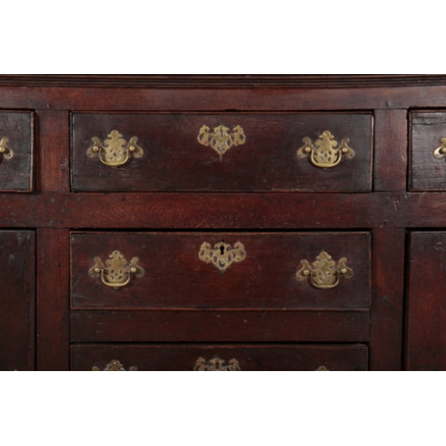 64 - AN 18TH CENTURY OAK DRESSER the upper section with moulded cornice over three shelves, the base fitt... 