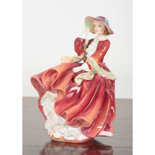 7 - THREE ROYAL DOULTON PORCELAIN FIGURES Belle of the Ball, 15cm high, Autumn Breezes, 20cm high, and T... 