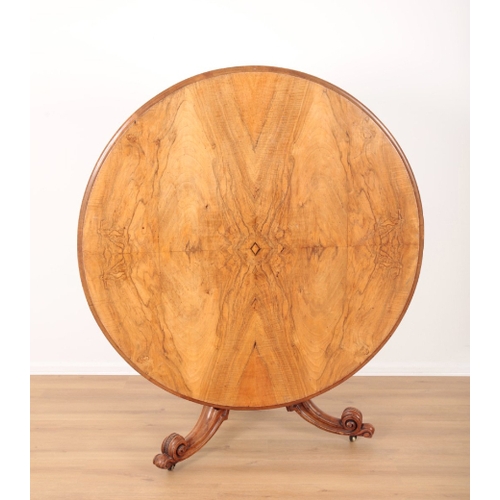 70 - A VICTORIAN WALNUT AND BURR WALNUT BREAKFAST TABLE the quarter veneered tilt top on a turned and gad... 