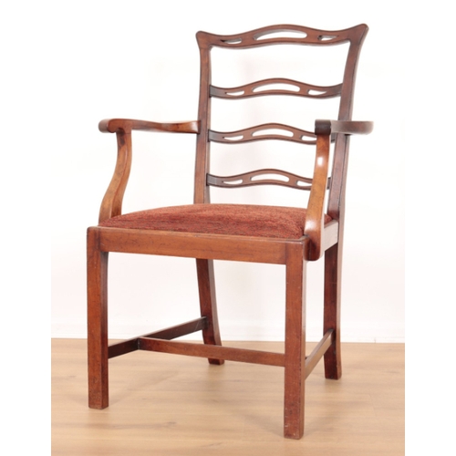 74 - A GROUP OF FOUR GEORGE III STYLE MAHOGANY DINING CHAIRS with pierced ladder-back splats over square ... 
